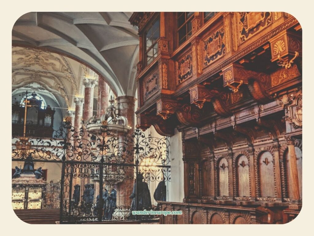 A complex combination of wrought iron and wood details in Court Church (Hofkirche) in Innsbruck, Austria