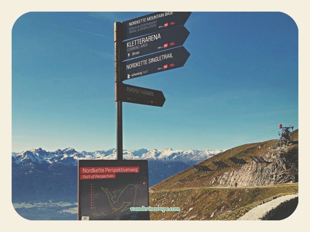 A signpost showing the directions of different hiking trails in Nordkette, Innsbruck, Austria