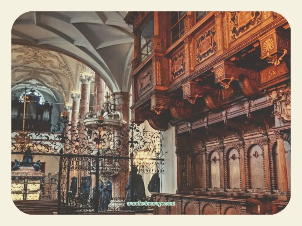 The beautiful architecture, wood works, and wrought iron railings inside Hofkirche, Old Town Innsbruck, Austria