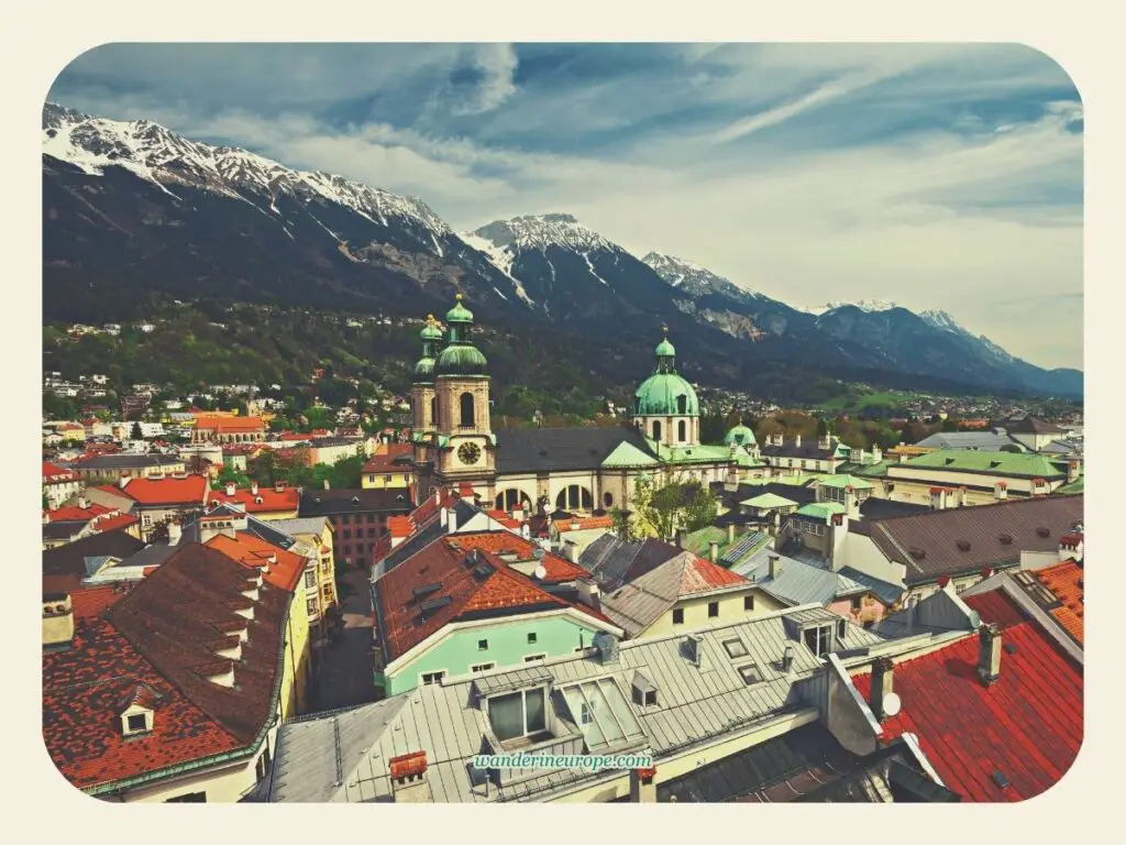 View of Innsbruck Cathedral against the majestic Nordkette Mountains in the backdrop, Innsbruck, Austria
