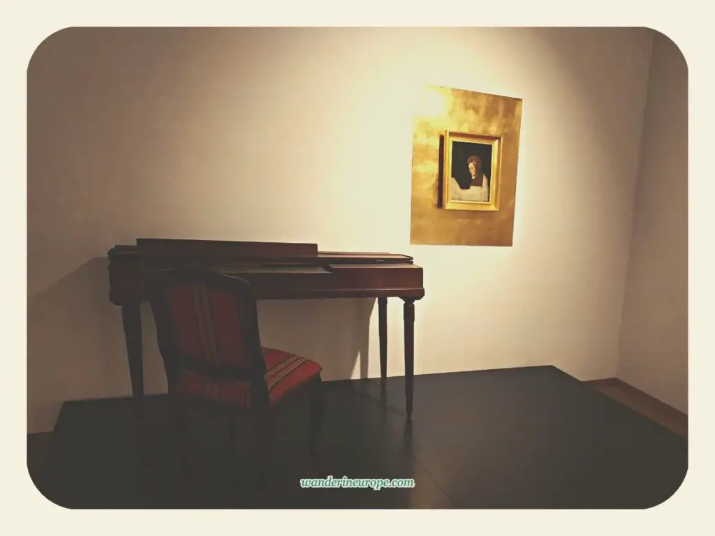 A piano and Mozart's portrait in Mozart's birthplace in Salzburg, Austria