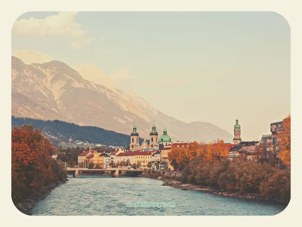 Golden hour view of Old Town and Nordkette along the Inn River, a simple beautiful sight to see on a 2-day trip to Innsbruck, Austria