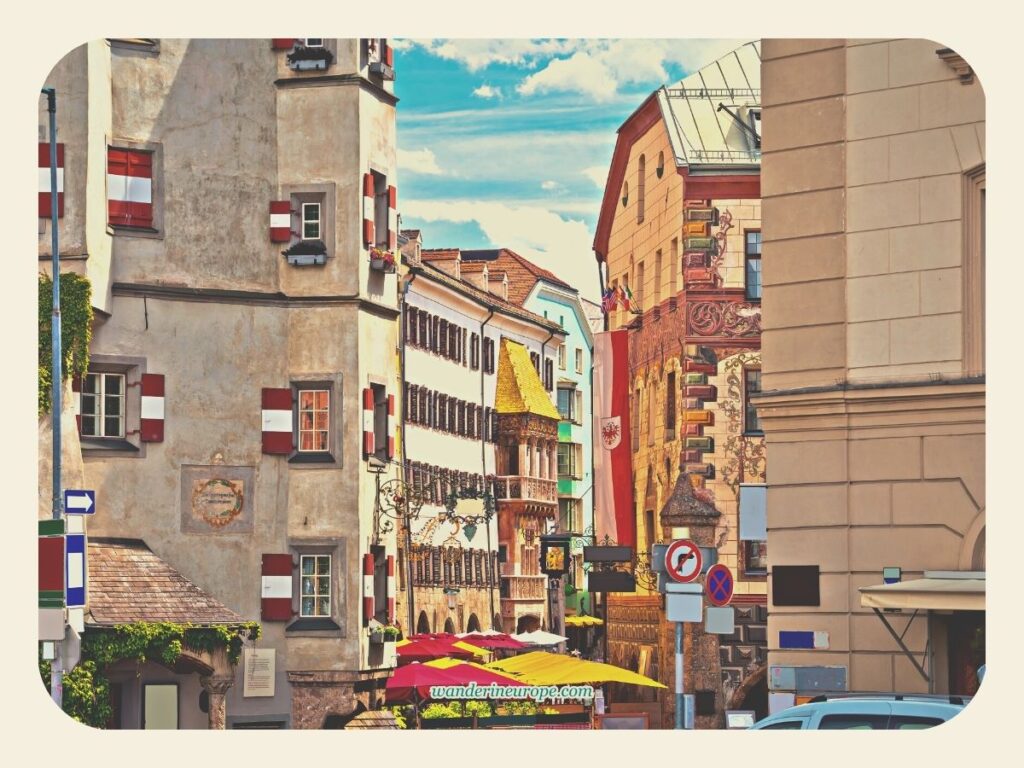 View of Ottoburg, Goldener Adler, and Golden Roof from the picture-perfect street of Herzog-Friedrich-Strasse in Old Town Innsbruck, Austria