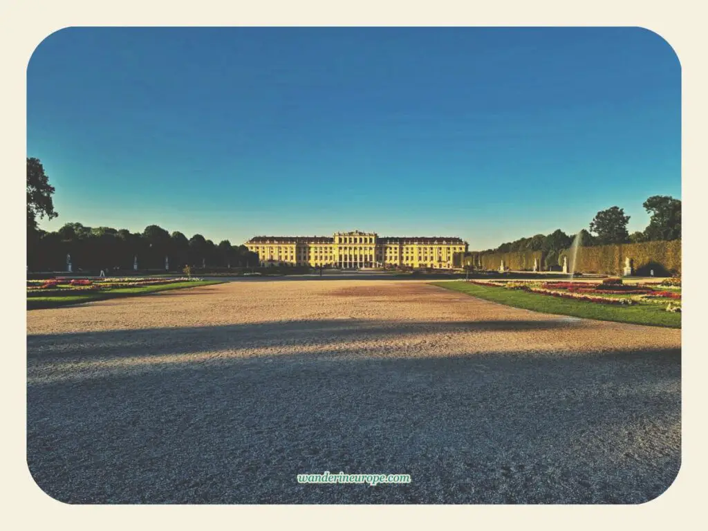 Golden hour view of the main palace from the Great Parterre of Schönbrunn Palace, Vienna, Austria