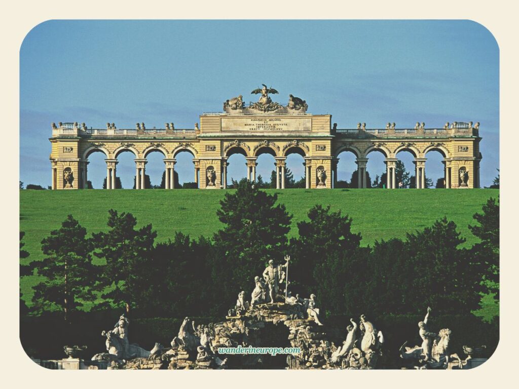 Zoomed in shot of the Gloriette and Neptune Fountain from the Great Parterre in Schönbrunn Palace, Vienna, Austria