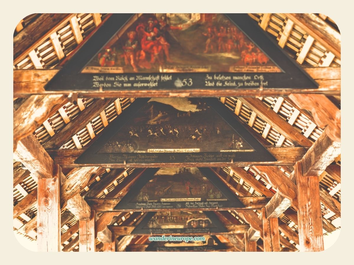Beautiful array of paintings on the roof the Chapel Bridge in Lucerne, Switzerland