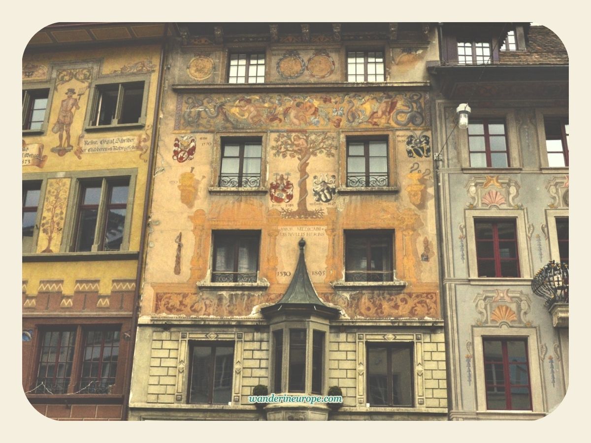 Beautiful mural-decorated houses in Weinmarkt in Lucerne, Switzerland