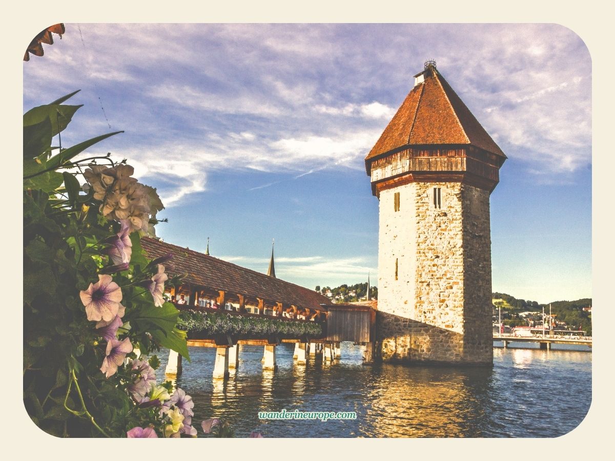 Golden hour view of the Chapel Bridge's tower from Bahnhofstrasse in Lucerne, Switzerland