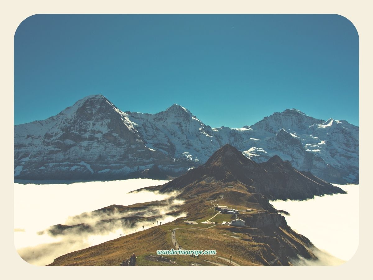 Mannlichen surrounded by a sea of clouds - summary free things to do one day in Grindelwald, Jungfrau Region, Switzerland