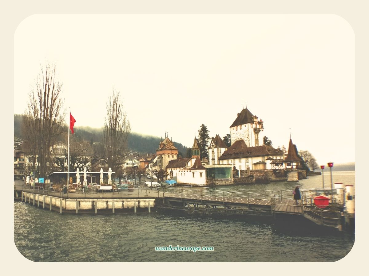 Oberhofen Castle in Lake Thun during a cloudy day, Switzerland