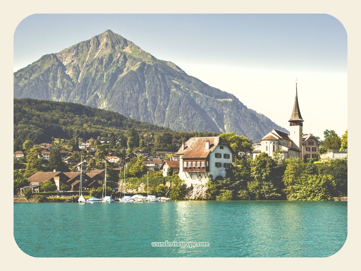 View of Mount Niesen and Spiez from the boat approaching the harbor in Lake Thun, Switzerland